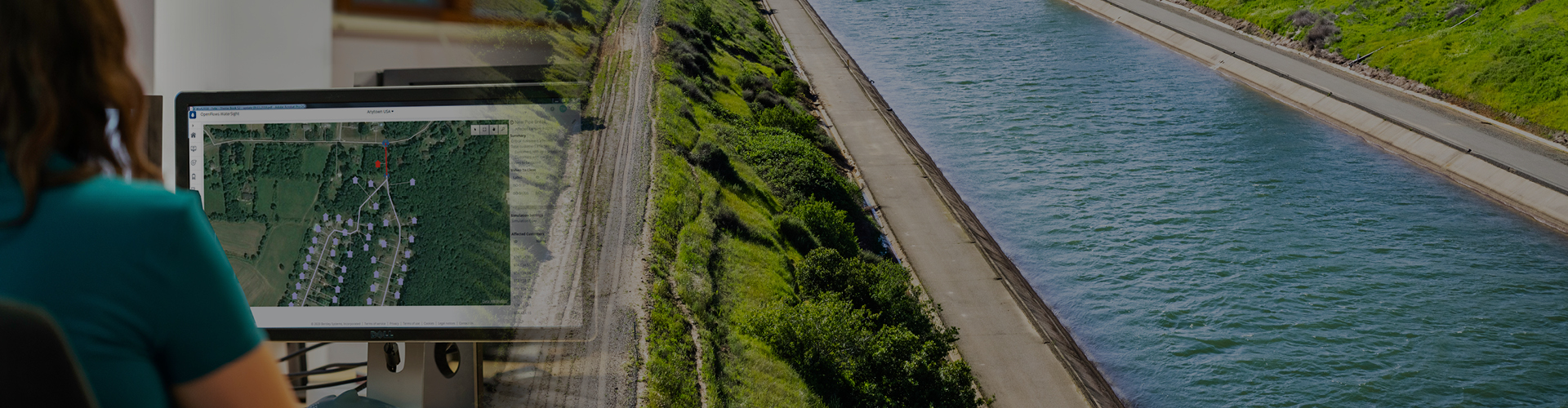A woman is studying a map of a river using CAD software.