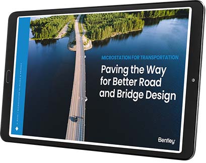 A tablet displaying an app with the text: "Paving the Way for Better Road and Bridge Design," showcases an image of a road and bridge over water, surrounded by forested areas. The app integrates MicroStation to enhance road and bridge design processes.